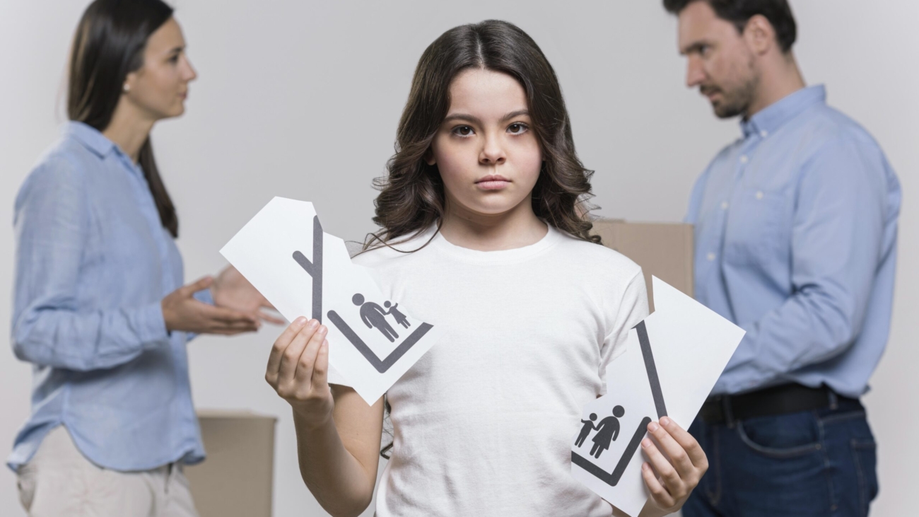 portrait-sad-girl-with-parents-arguing